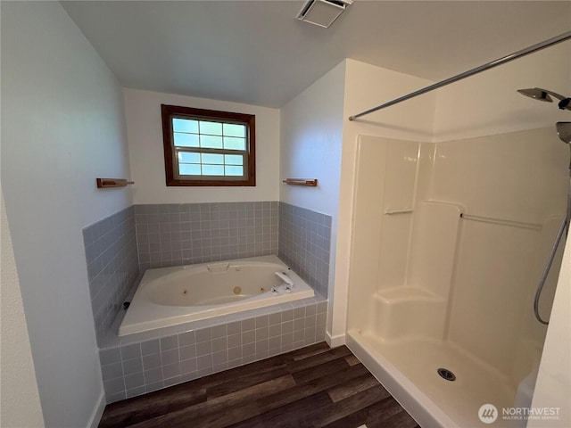 106 Alder St, Pe Ell, WA 98572 - bathroom with a jetted tub, visible vents, walk in shower, and wood finished floors