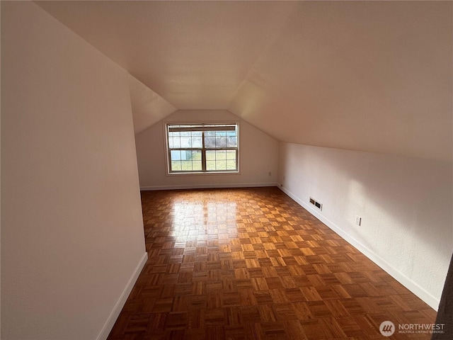106 Alder St, Pe Ell, WA 98572 - additional living space with vaulted ceiling, visible vents, and baseboards