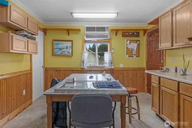 723 E 54th St, Tacoma, WA 98404 - kitchen featuring light countertops, a wall mounted air conditioner, wainscoting, and light carpet