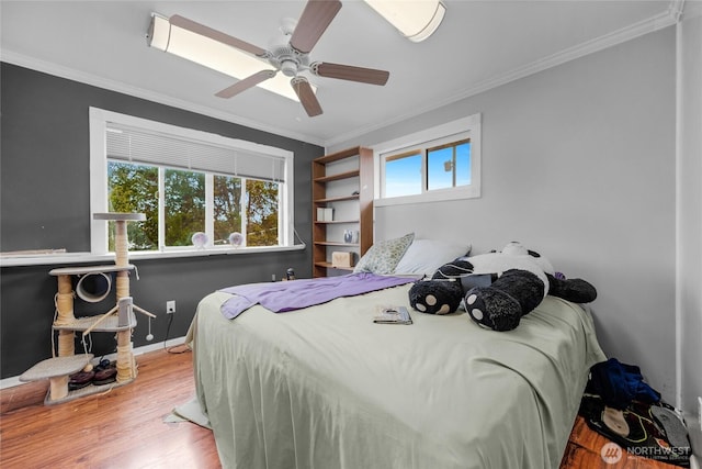723 E 54th St, Tacoma, WA 98404 - bedroom with ornamental molding, multiple windows, and wood finished floors