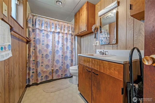 723 E 54th St, Tacoma, WA 98404 - bathroom featuring a shower with shower curtain, vanity, toilet, and tile patterned floors