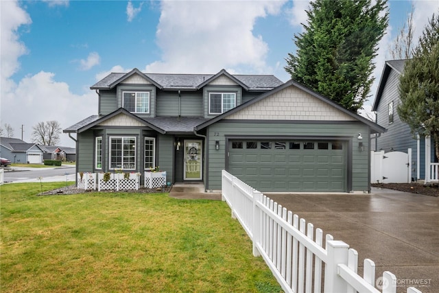 traditional home featuring a shingled roof, a front yard, fence, a garage, and driveway