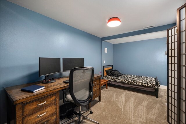 carpeted office space with visible vents