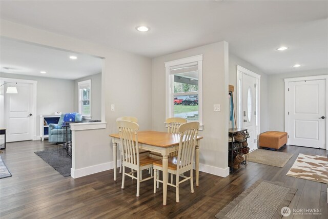 dining space with baseboards, dark wood-style flooring, and recessed lighting