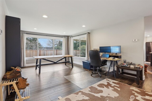 office space featuring baseboards, hardwood / wood-style floors, and recessed lighting