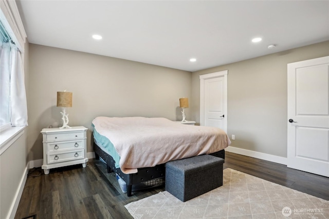 bedroom featuring dark wood-type flooring, recessed lighting, and baseboards