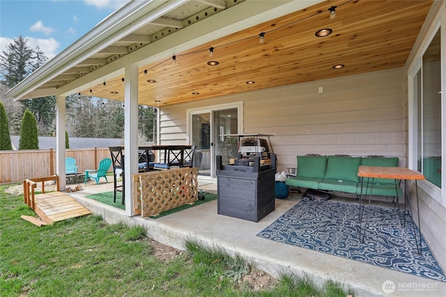 view of patio / terrace featuring fence and an outdoor hangout area