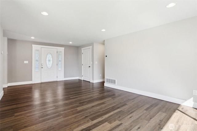 foyer with recessed lighting, baseboards, visible vents, and dark wood finished floors