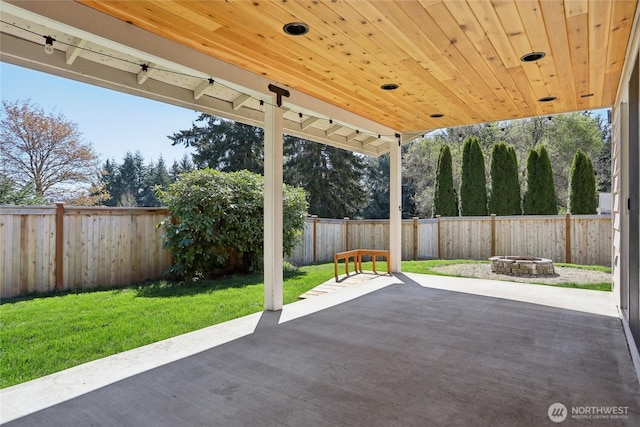 view of patio / terrace with a fenced backyard and an outdoor fire pit