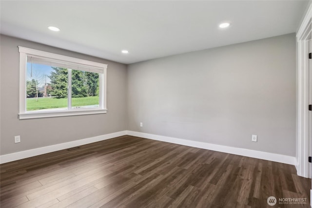 unfurnished room featuring baseboards, recessed lighting, and dark wood-type flooring