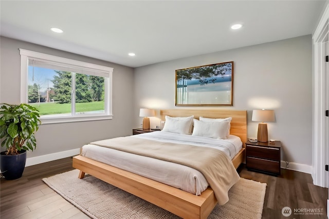 bedroom featuring baseboards, recessed lighting, and wood finished floors