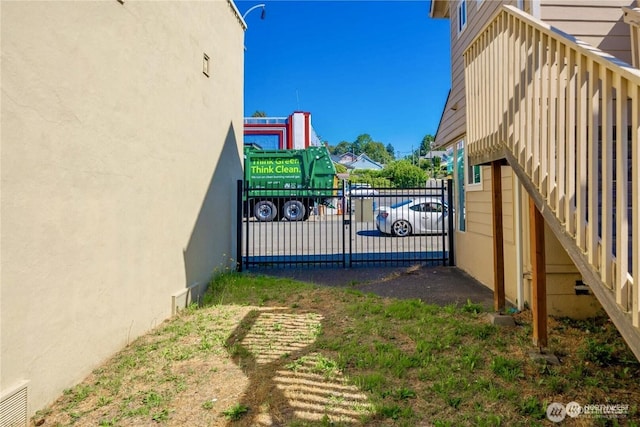 view of gate with fence