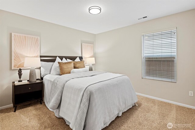 bedroom featuring carpet flooring, baseboards, and visible vents