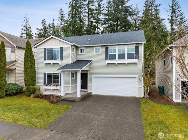 traditional-style home with an attached garage, concrete driveway, a front lawn, and roof with shingles