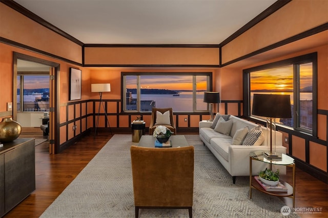 living room featuring crown molding and wood finished floors