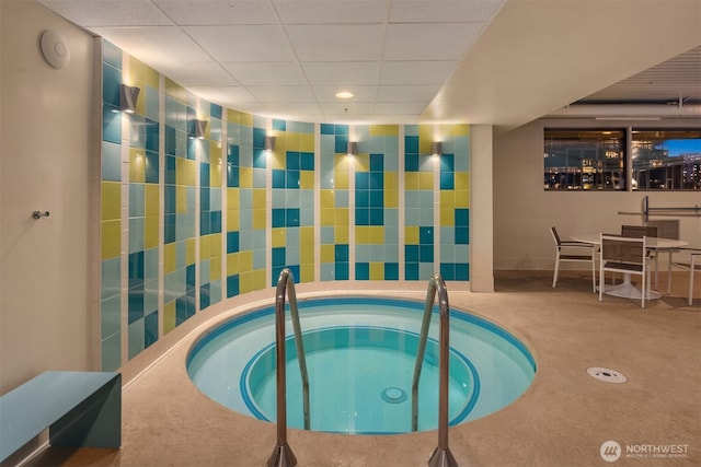 view of pool featuring outdoor dining area and a community hot tub