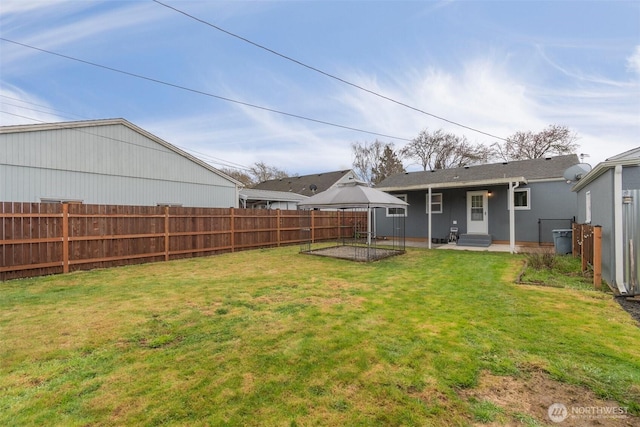 view of yard featuring a fenced backyard