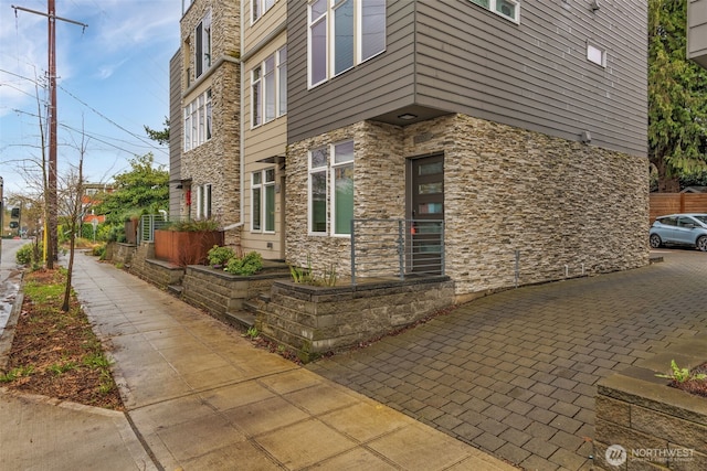 view of home's exterior with stone siding