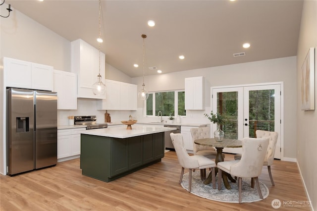 kitchen featuring visible vents, white cabinets, light countertops, french doors, and appliances with stainless steel finishes