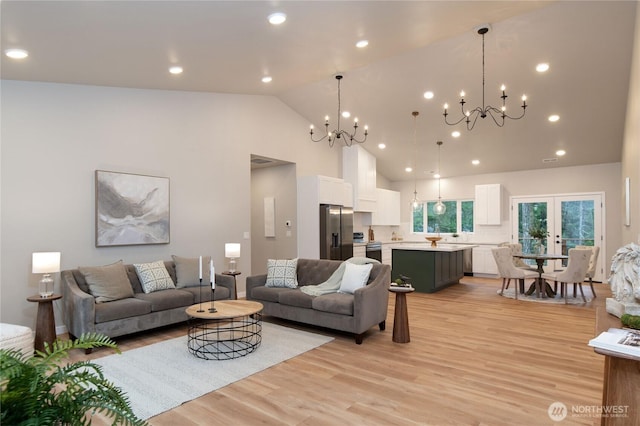 living room with recessed lighting, light wood-style flooring, high vaulted ceiling, and french doors