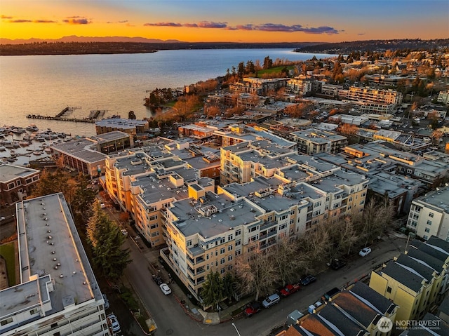 aerial view at dusk with a water view