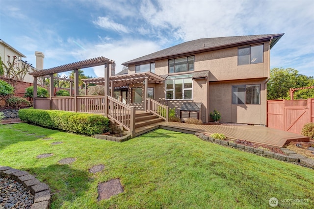 rear view of property with fence, a pergola, stucco siding, a deck, and a lawn