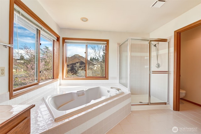 full bath featuring visible vents, a stall shower, tile patterned flooring, a garden tub, and toilet