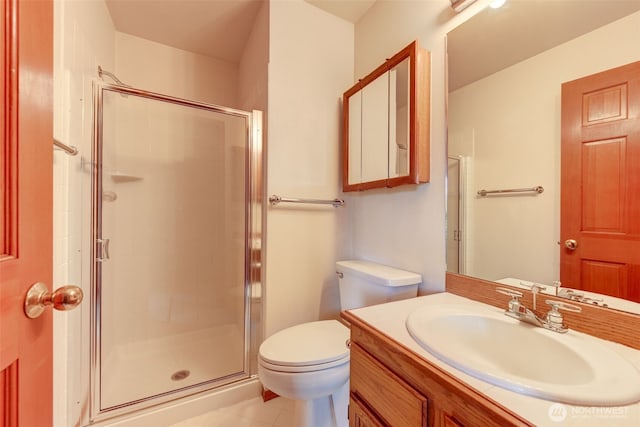 full bathroom with vanity, toilet, and a shower stall