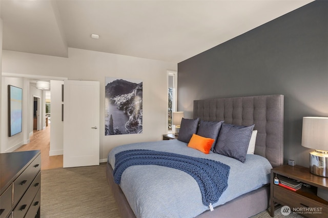 bedroom with carpet flooring and baseboards