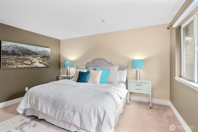 bedroom with carpet flooring and baseboards