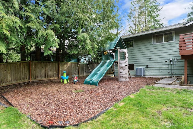 view of play area featuring central AC and fence