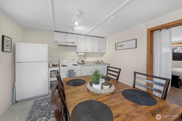 dining space with rail lighting