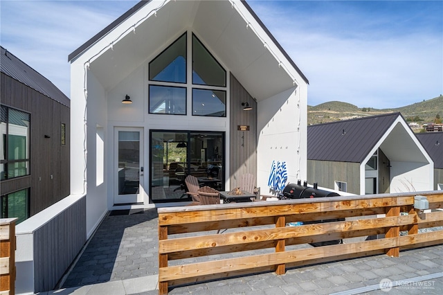 rear view of house with a mountain view