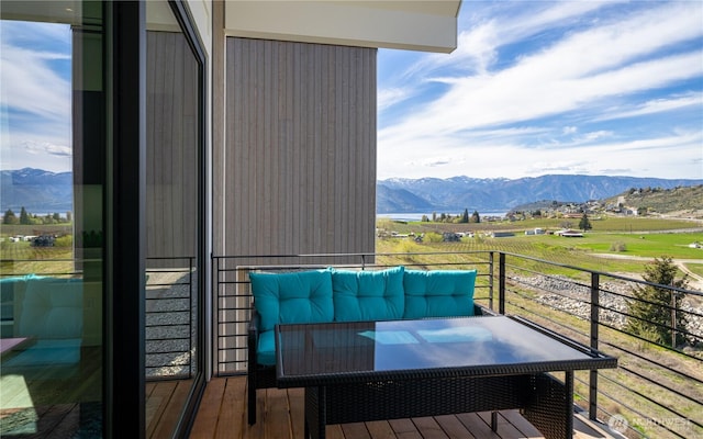 balcony featuring a mountain view