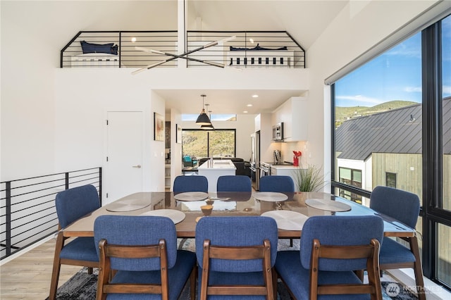 dining area with light wood-style floors