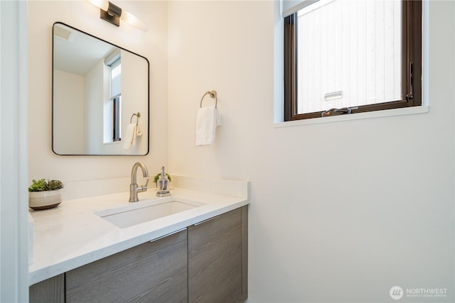 bathroom featuring plenty of natural light and vanity