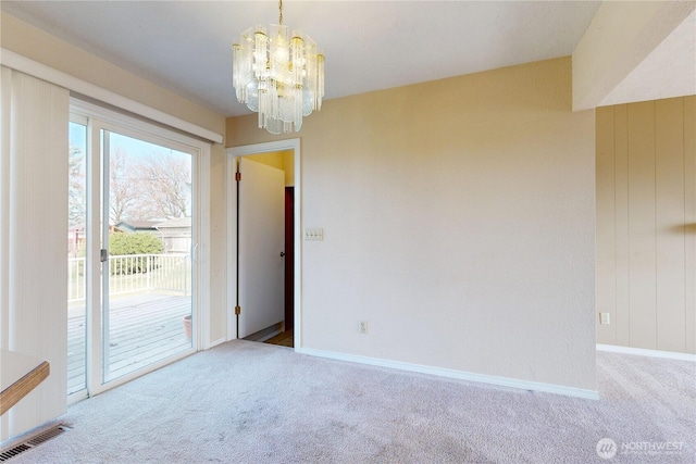 515 SE 5th St, College Place, WA 99324 - unfurnished room with carpet floors, baseboards, visible vents, and a chandelier