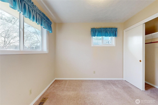 515 SE 5th St, College Place, WA 99324 - unfurnished bedroom with a closet, carpet flooring, visible vents, and baseboards