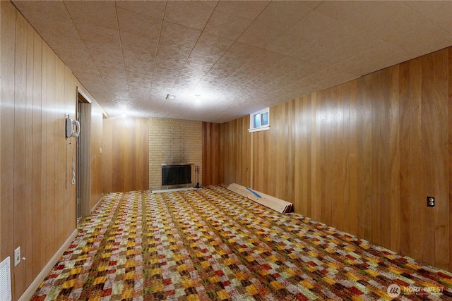 515 SE 5th St, College Place, WA 99324 - basement featuring wood walls and a fireplace