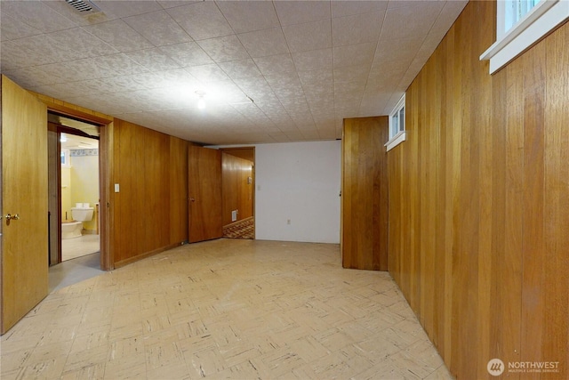 515 SE 5th St, College Place, WA 99324 - interior space with light floors, wood walls, and visible vents