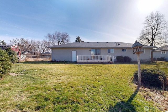 515 SE 5th St, College Place, WA 99324 - rear view of house featuring fence and a lawn