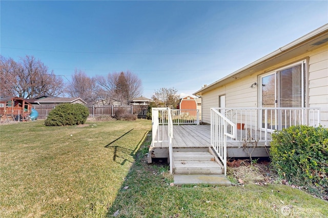 515 SE 5th St, College Place, WA 99324 - view of yard featuring a deck, a playground, and fence