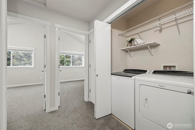 laundry room featuring carpet floors, laundry area, baseboards, and washer and dryer