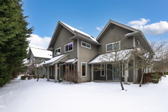 view of snow covered house