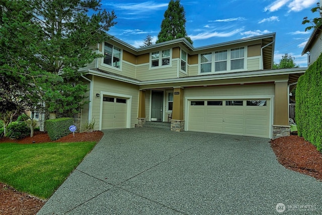 prairie-style house with driveway, stone siding, and an attached garage