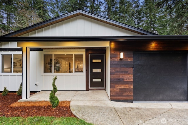 view of front of home with an attached garage and board and batten siding