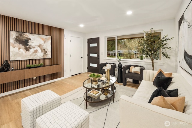 living room with recessed lighting and wood finished floors