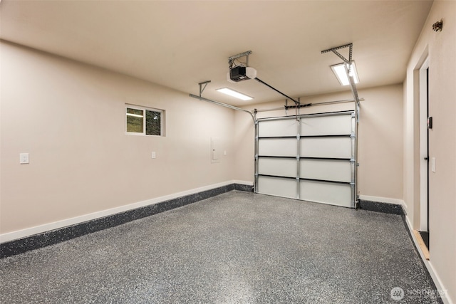 garage featuring a garage door opener and baseboards