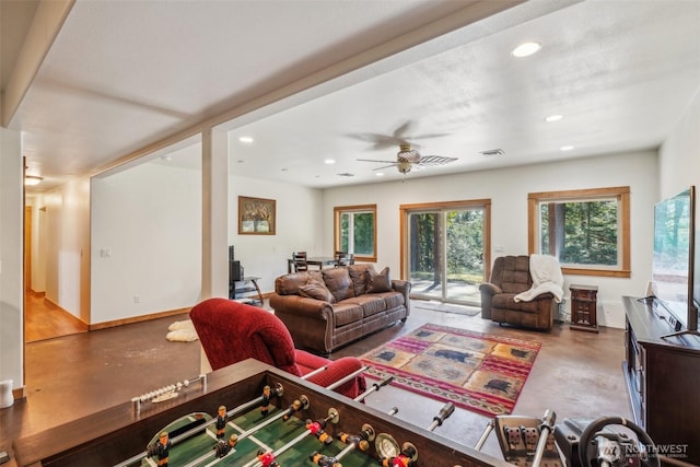 living area with baseboards, concrete floors, visible vents, and recessed lighting