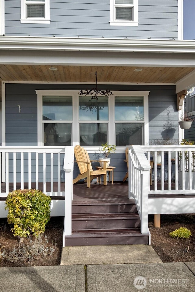 view of exterior entry with covered porch